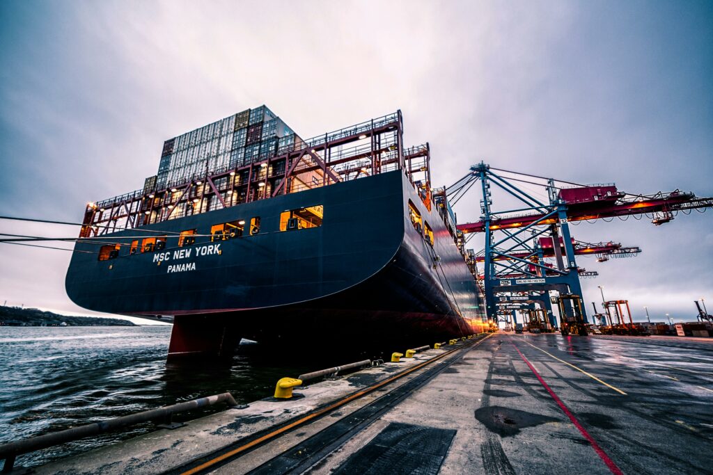 pexels-photo-906982-906982 A large cargo ship docked at Gothenburg port with industrial cranes, Sweden.